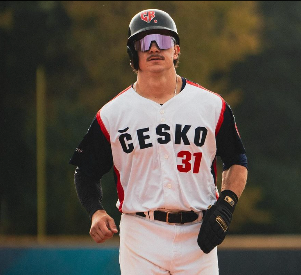 A Czech Republic baseball player Willie Escala confidently steps forward wearing Hit Hero gear, equipped with the Baseball Thumb Guard. The moldable design offers unparalleled protection and comfort, enhancing performance during every game.