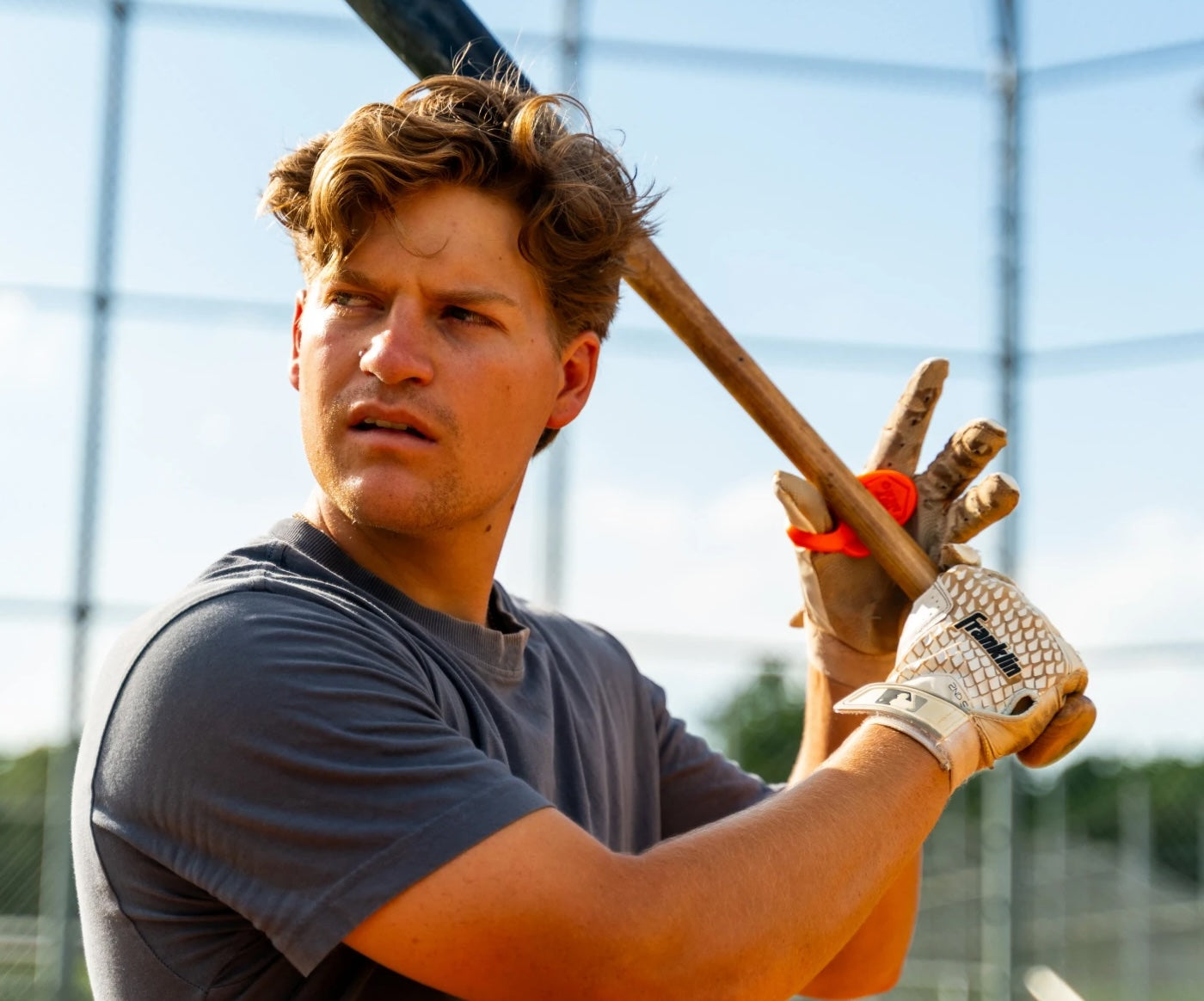 Batter loading up with a Hit Hero thumb guard on his hand
