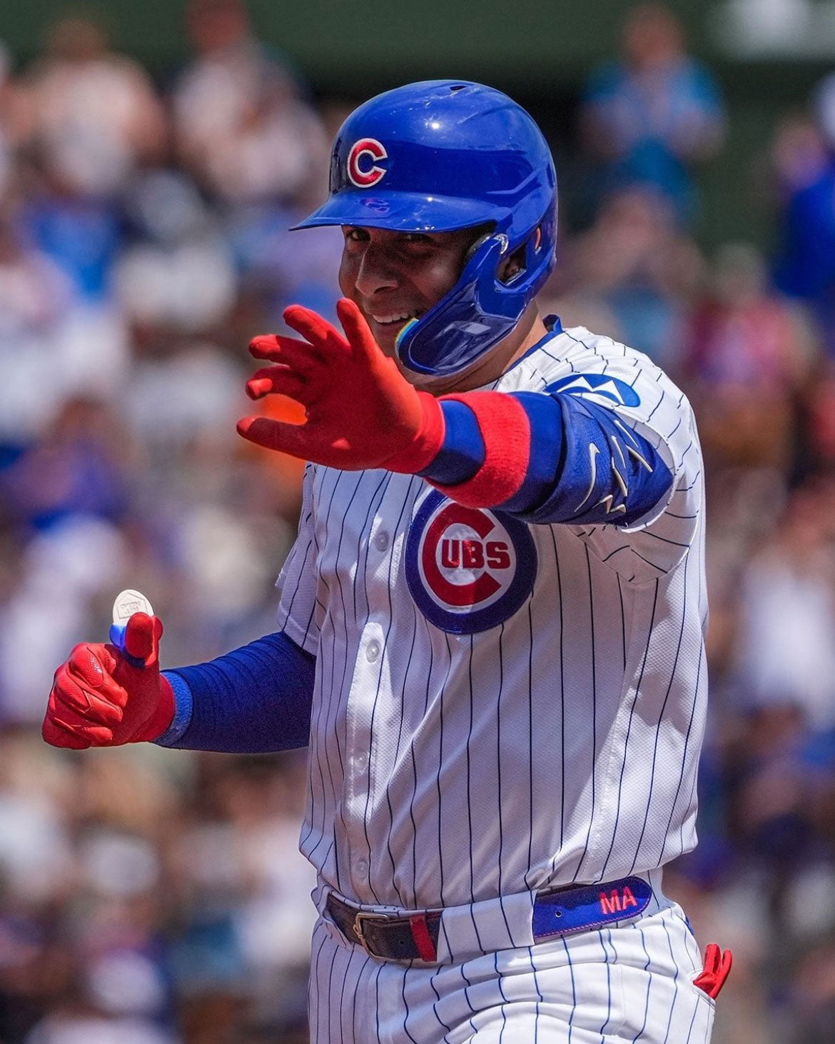 Ballplayer at the plate wearing a Hit Hero thumb guard