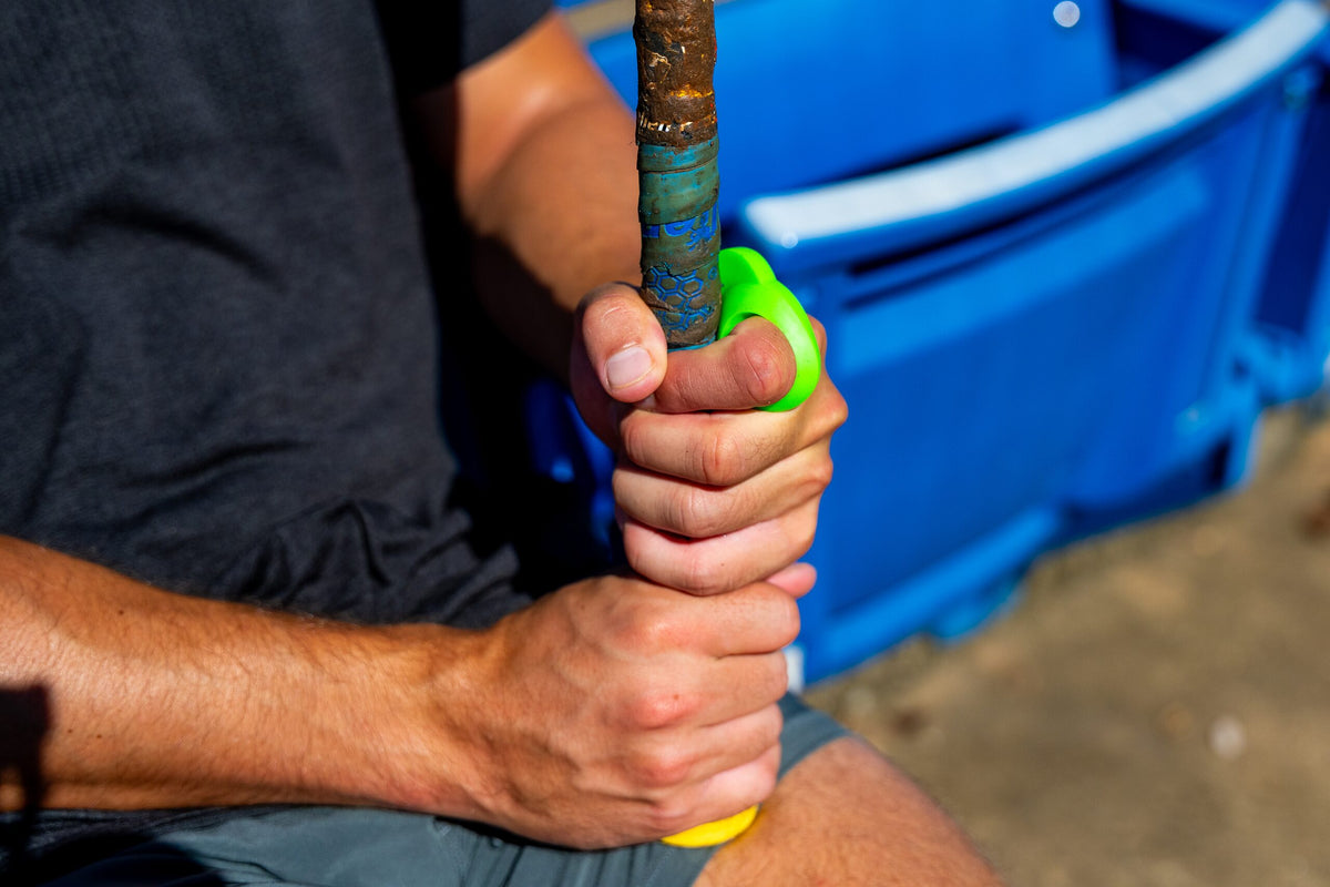 Hit Hero worn on the index finger while gripping a bat